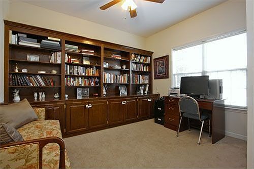 Cozy Den with Built-In Bookcases