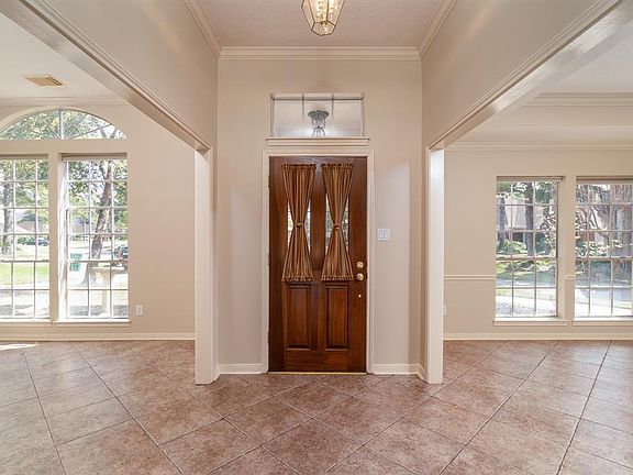 Upon entry, ceramic tile flooring flows throughout the space, into the formal living, dining, family room and kitchen areas, and is so easy to maintain!