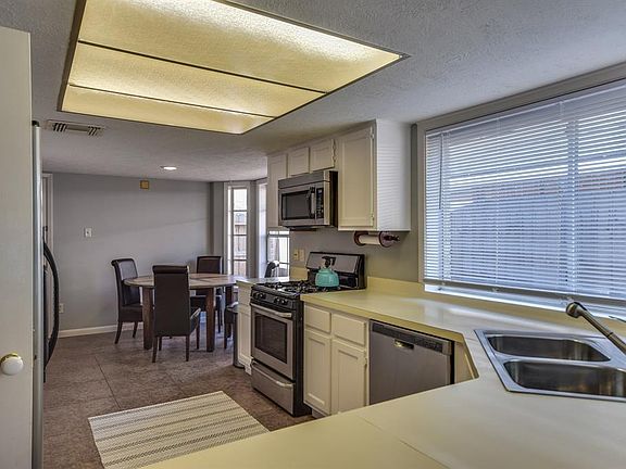 The kitchen has recently been updated with stainless appliances, sink, disposal and refinished cabinets.