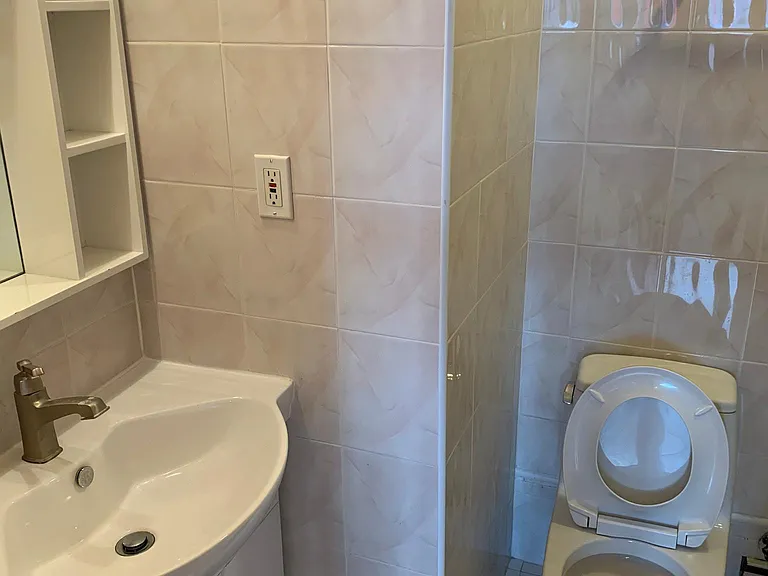 Sink and toilet of the master bedroom bathroom