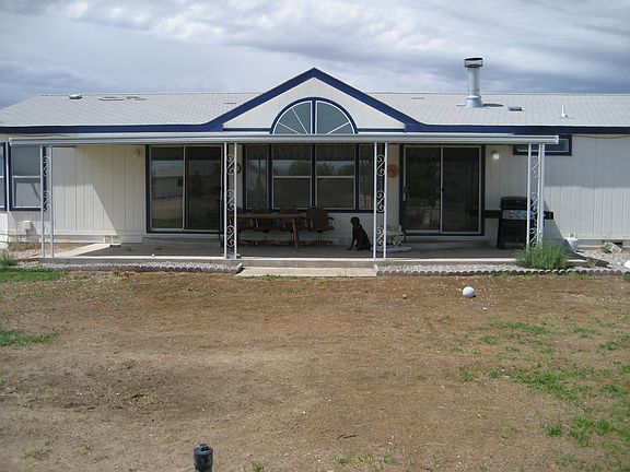 Back of home and Covered Patio