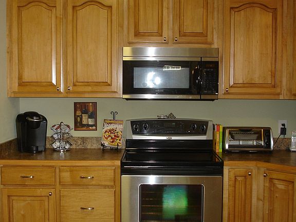View of custom maple cabinets in kitchen