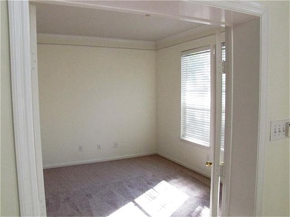 French doors offer privacy to this study. Carpeting replaced