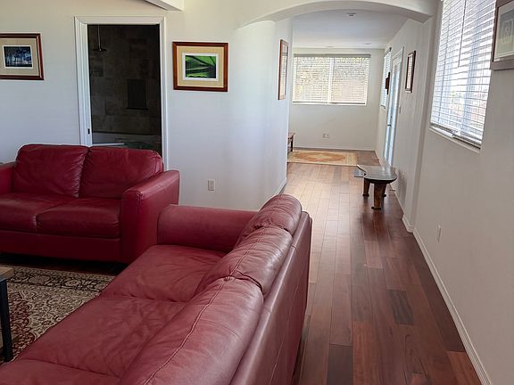 Partial view of the living room and doorway to bathroom