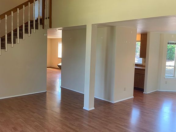 Living room looking toward entrance to kitchen and family room