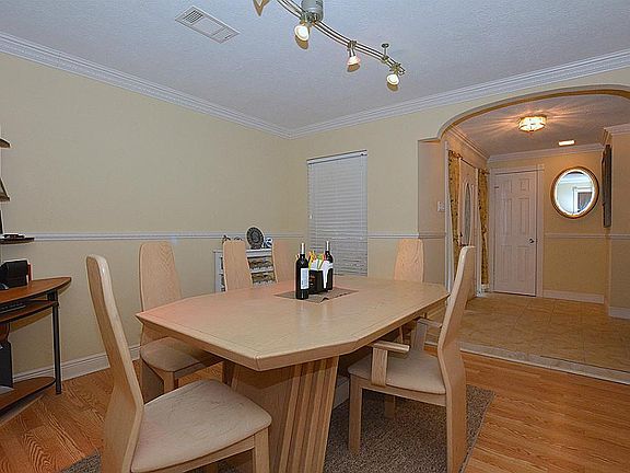 View from the formal dining to the tiled entry foyer.