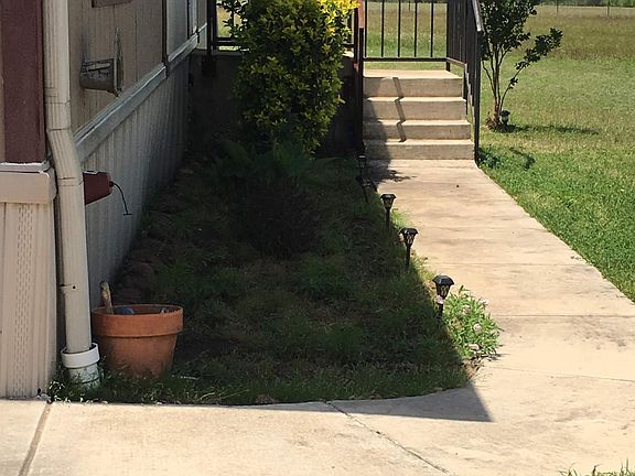 Walkway to the front door from the car port