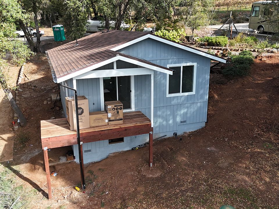 Rear of home - deck is in progress for railings.