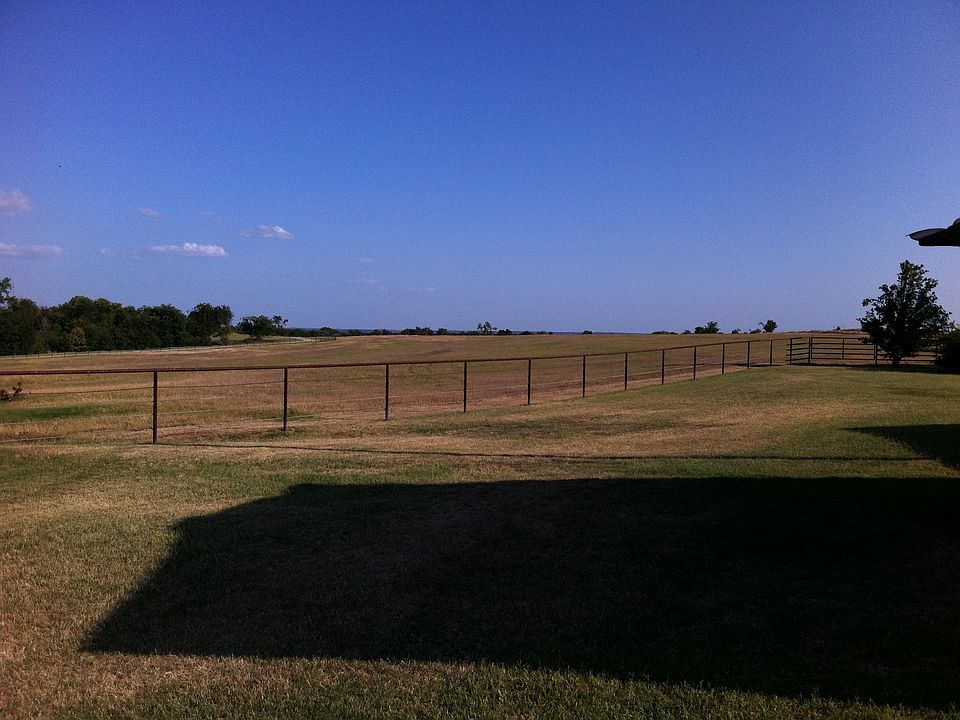 Pipe & cable fence behind house