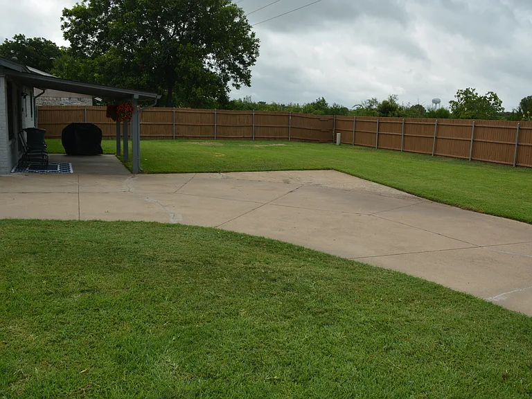 Enjoy our large driveway to fit multiple cars with-in the gated area.