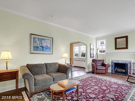Spacious Living Room Features Beautiful Fireplace