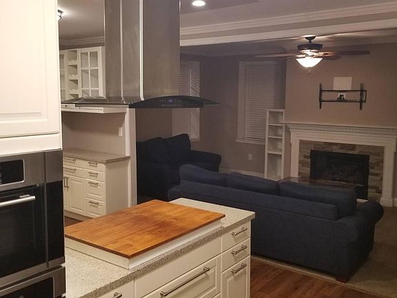 Kitchen with stainless steel appliances and gas range.