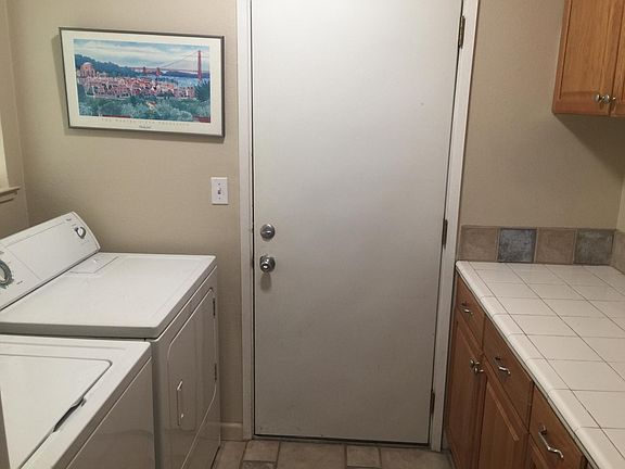 Indoor laundry room with lots ignored storage and folding area!