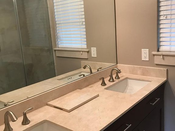 Renovated Master Bath with Marble Countertops and Two Sinks