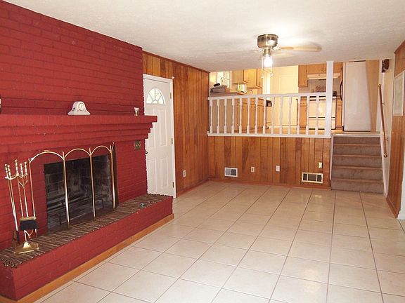 Family Room with brick hearth fireplace!
