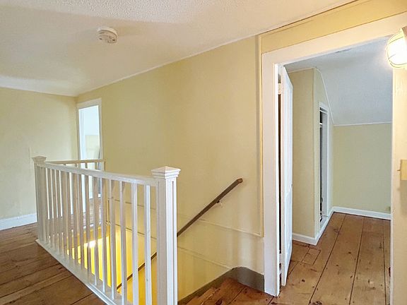 Hallway showing doorways to both bedrooms, bedrooms are same size