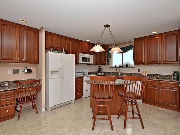 You will love these 42" cherry wood cabinets, the kitchen island, the desk and a huge pantry.