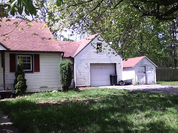 Attached garage and shed