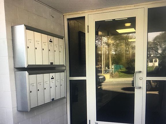 Front entrance; locked door w/ security cameras and video intercom