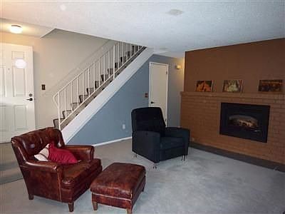 The living room features a gas fireplace.