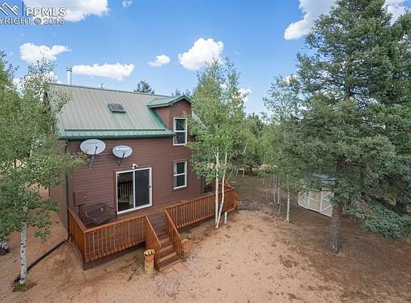 Just under 3/4 acres, this property has both colorful deciduous and ever green trees all around