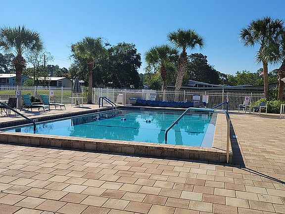 Olympic size pool in park.