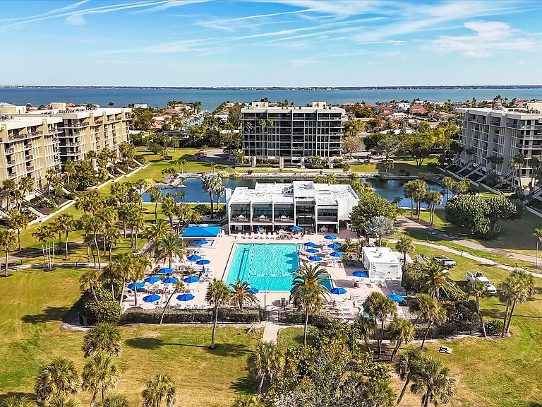 About 30+ acres of beautifully landscaped grounds, walking path and pond, lighted tennis courts, pickleball, ping-pong, clubhouse and social areas.