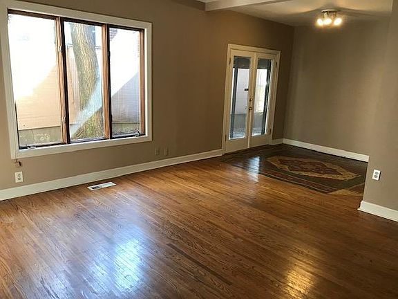 Living room with French doors leading to private courtyard.