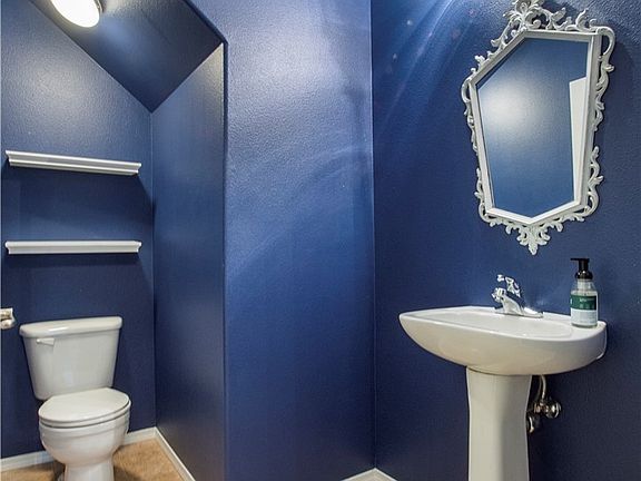 1/2 bath on main floor.  Mirror goes with Seller