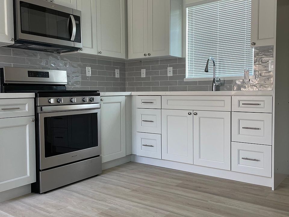 Brand new kitchen! Everything is new! And gorgeous. This is your actual kitchen and flooring is in every room.