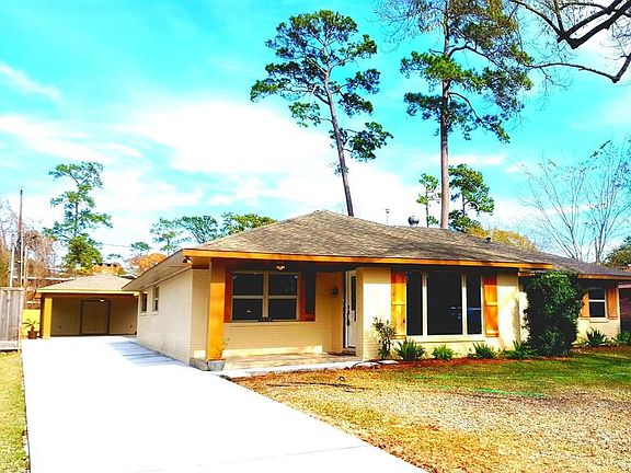 NEW EXTRA LONG DRIVEWAY TO LARGE OPEN COVERED PARKING; STEP UP FRONT PORCH TO UPDATED, UPSCALE CONTEMPORARY RANCH HOME WITH ALMOST 2800 SQ FT OF LIVING!