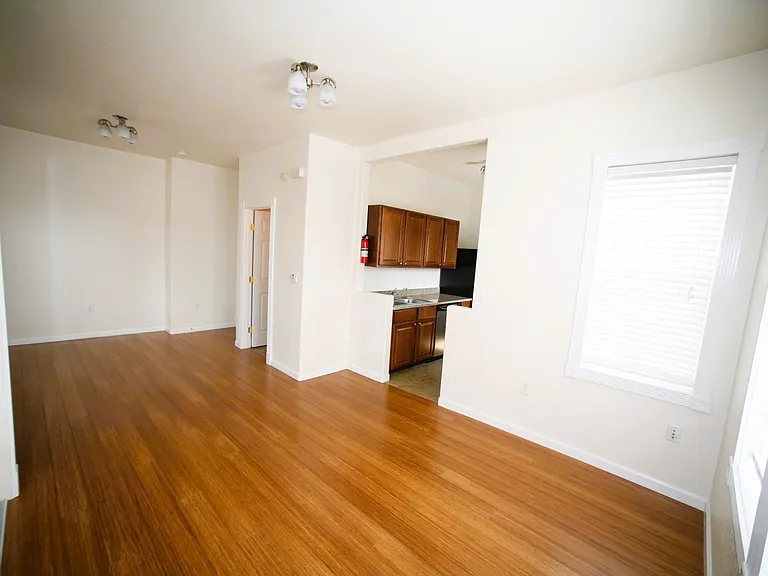 View from the the "bedroom" end, showcasing the full layout with plenty of room for distinct living, kitchen and sleeping zones.