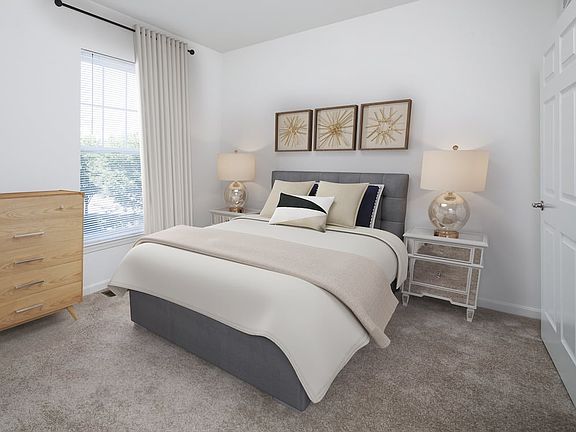 Bedroom with carpeted flooring