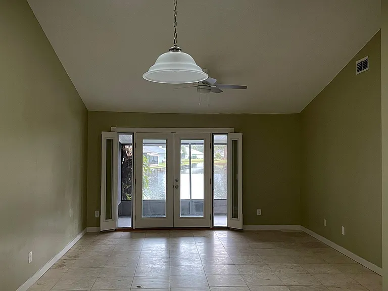 Family Room- view from the kitchen. French doors closed with side wing doors open