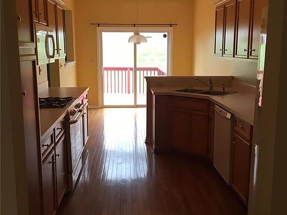 Kitchen area with hardwood floors