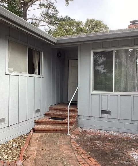 Front entrance. Natural light for living room and East bedroom