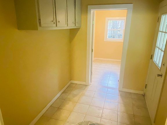 Mud room off the laundry room and kitchen with direct access to the new covered patio.