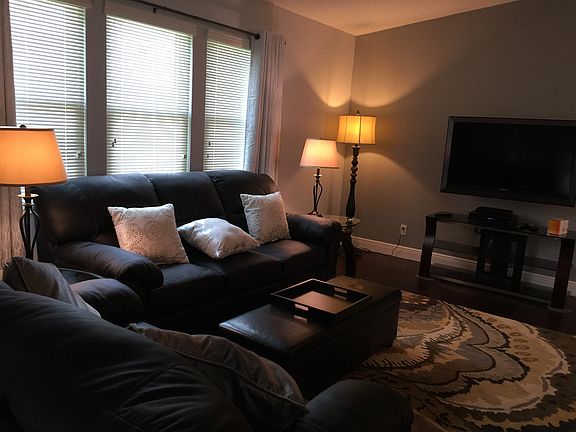 Furnished family room with sofa bed for additional guests.