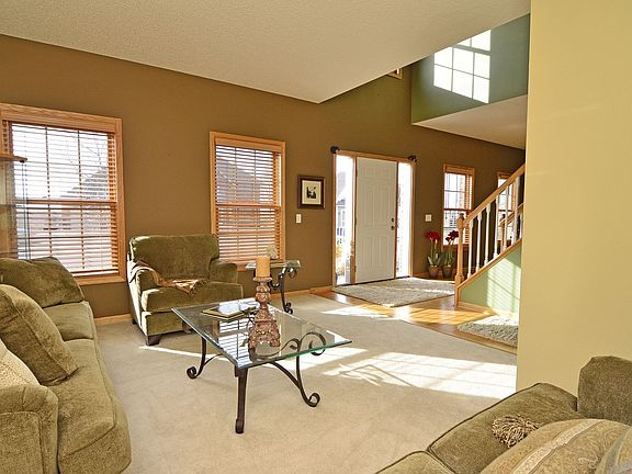 Brimming with light, the sun-filled foyer leads to the formal living room.  