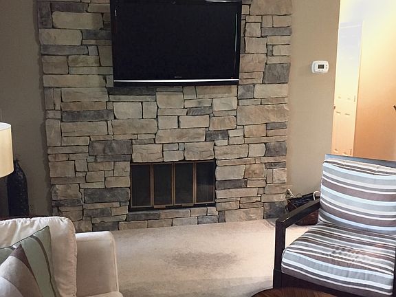Custom stone wall fireplace