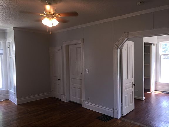 Living room with French doors into 3rd bedroom