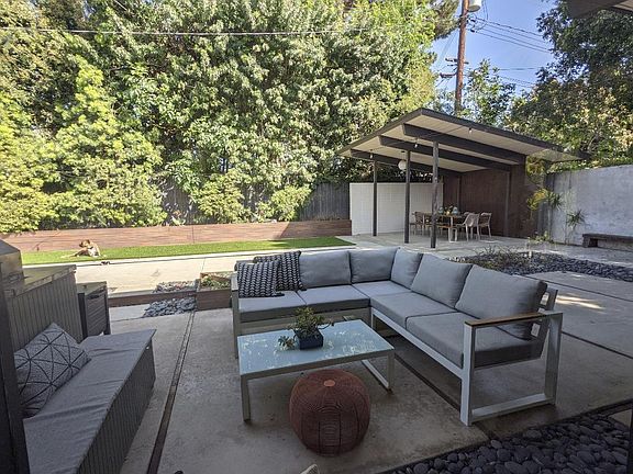 Outdoor seating are with storage bench and couch