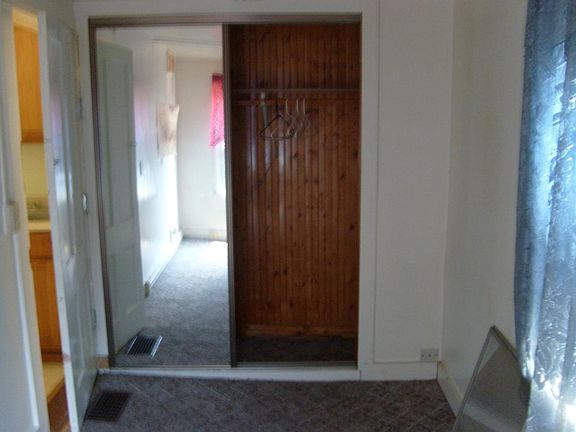 Bedroom near wall (closet)