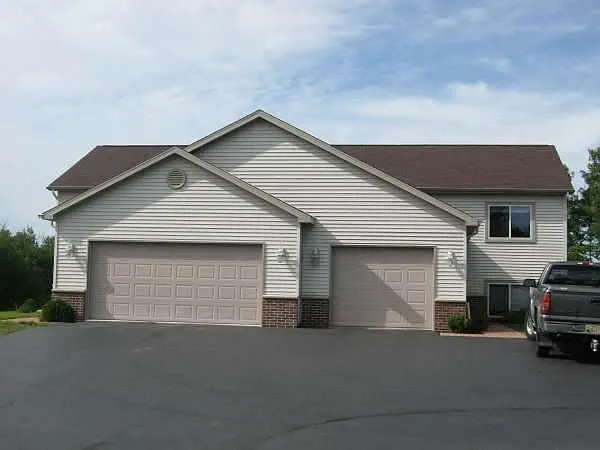 5261 Street view- left side w/ 2 car attached garage