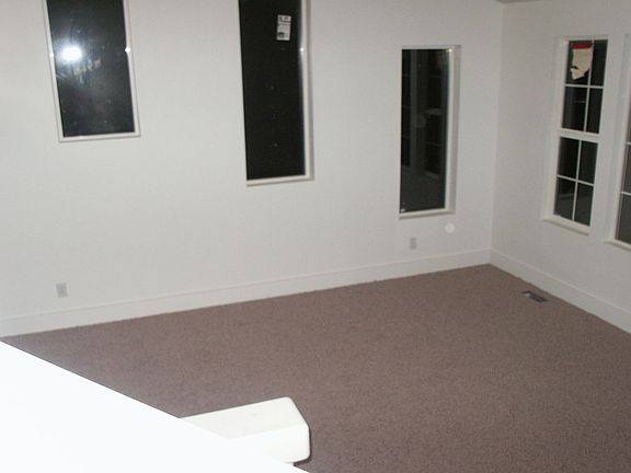 Looking down from kitchen to part of the 1st living room