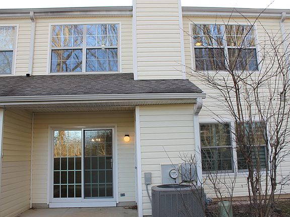 Exterior of 126 Deerfield with attached outdoor storage shed.