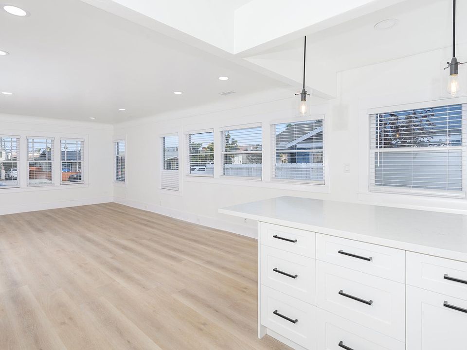 Big Living Area With Recessed Lighting Looking From Kitchen