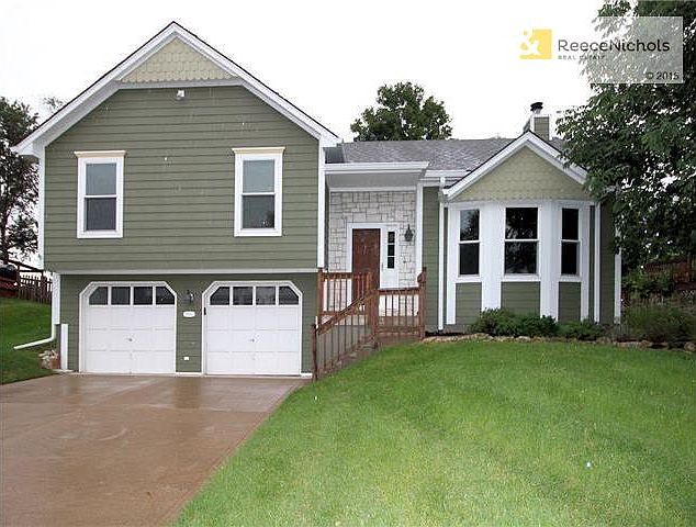 Hardie siding and new windows in 2010 with stone accents.