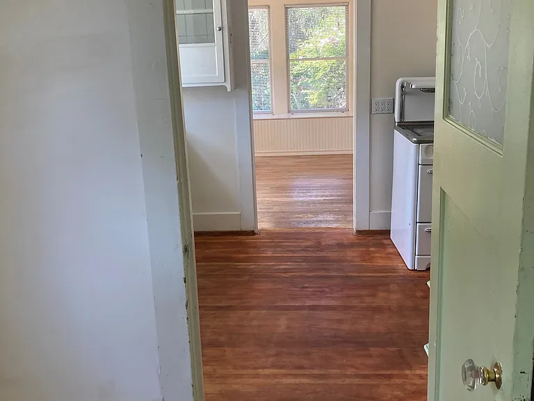 View from laundry pantry to kitchen and dining room beyond