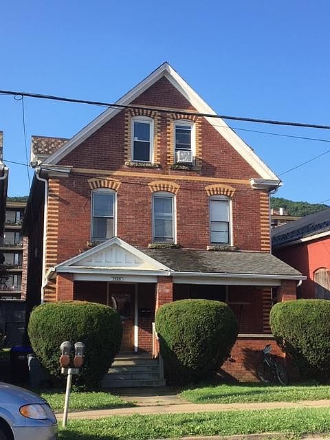 Apt #2 is the 2nd and 3rd Floor; front and rear porches are under roof; small front yard; large back yard